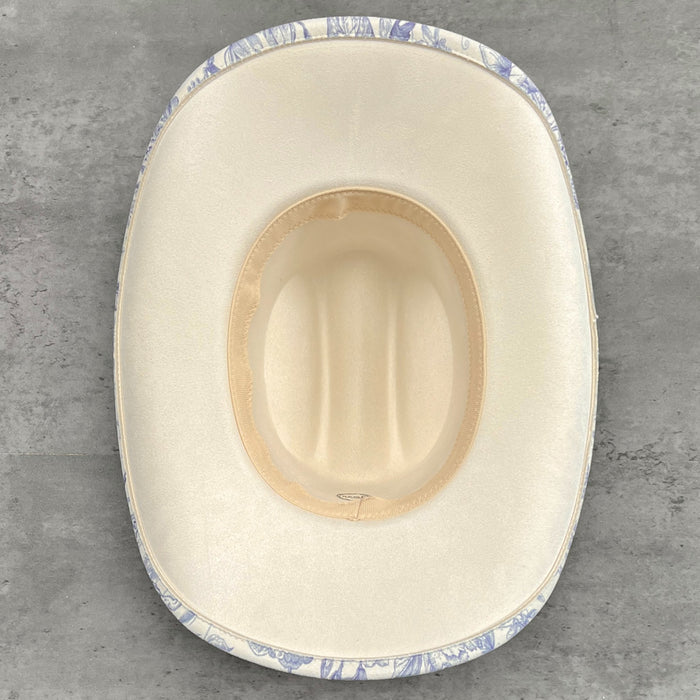 611fc05e3c4ce80992caae23_blue-chinoiserie-ivory-cattleman-cowboy-base_1776441547168.jpg