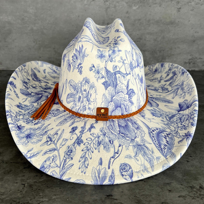 611fc05e3c4ce80992caae23_blue-chinoiserie-ivory-cattleman-cowboy-back_1776441558301.jpg