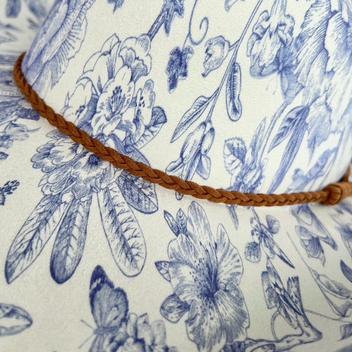 611fc05e3c4ce80992caae23_blue-chinoiserie-ivory-cattleman-cowboy-detail_1776441583911.jpg