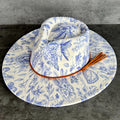 611fc05e3c4ce80992caae23_blue-chinoiserie-ivory-teardrop-rancher-front-angle_1776441917361.jpg
