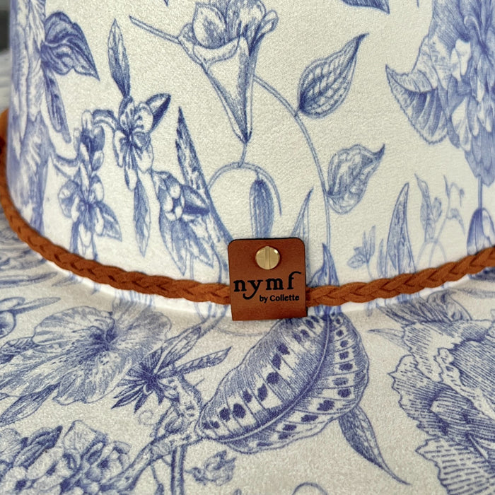 611fc05e3c4ce80992caae23_blue-chinoiserie-ivory-teardrop-rancher-back-detail_1776441955068.jpg