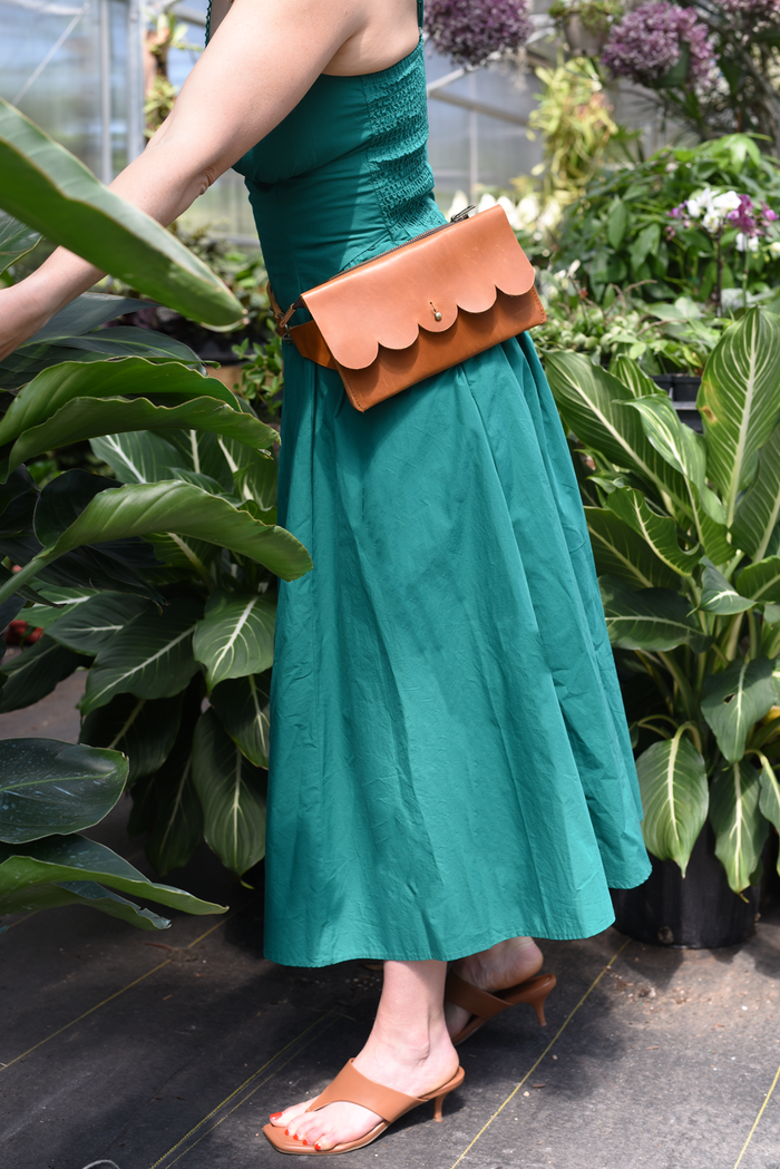 611fc05e3c4ce80992caae23_scallop-sling-bag-brown-belt_1785430390044.png