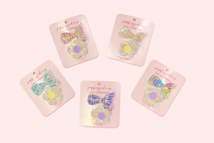 611fc05e3c4ce80992caae23_iridescent-hair-accessories-display_1771224190385.png