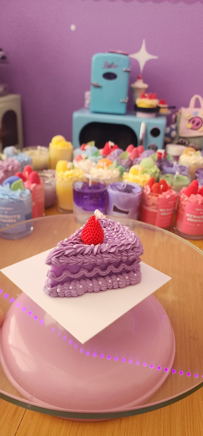 611fc05e3c4ce80992caae23_purple-cake-slice-candle1_1783730513621.jpg