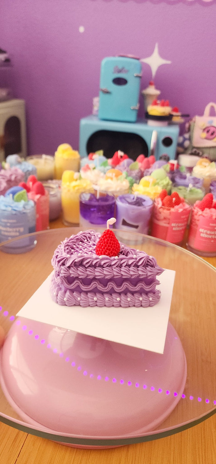 611fc05e3c4ce80992caae23_purple-cake-slice-candle3_1783730513622.jpg